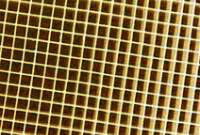 Close-up of a ceramic grid coated with catalytically active substances.