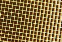 Close-up of a ceramic grid coated with catalytically active substances.